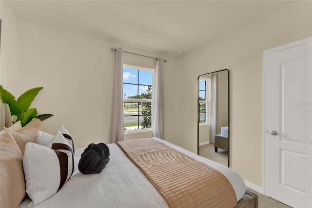 bedroom with light colored carpet