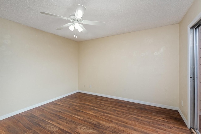 spare room featuring a textured ceiling, dark wood-type flooring, and ceiling fan