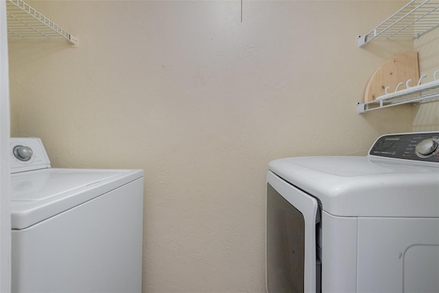 laundry room featuring washing machine and dryer