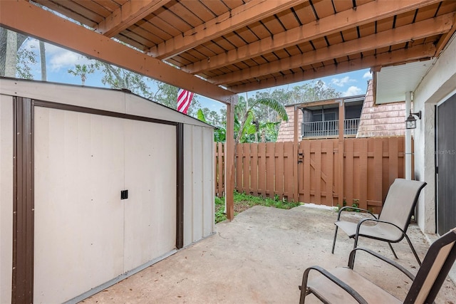 view of patio featuring a shed