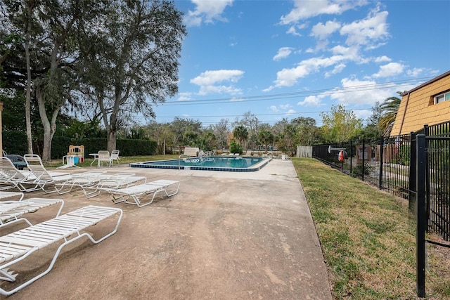 view of pool featuring a playground and a patio