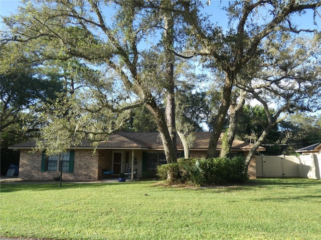 ranch-style house with a front yard