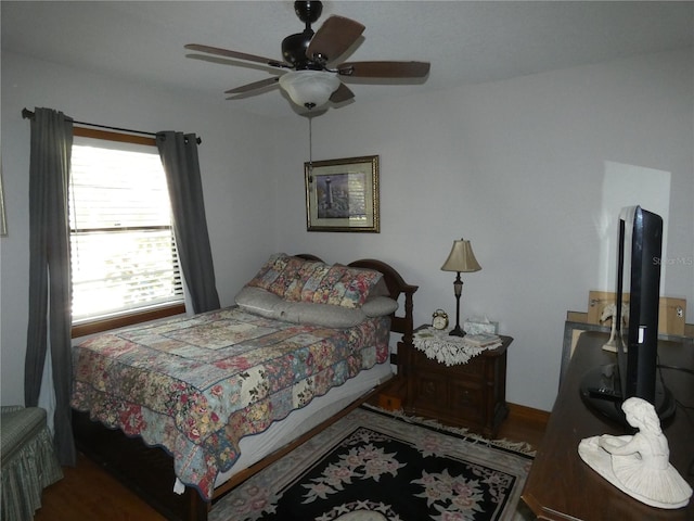 bedroom with ceiling fan and hardwood / wood-style floors