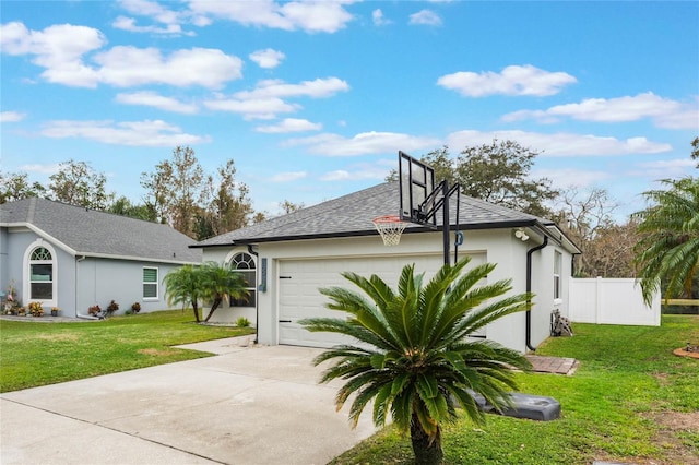 view of side of home with a garage and a lawn