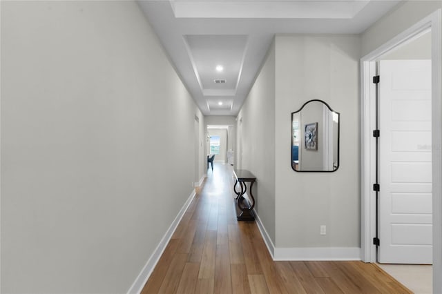 corridor with light hardwood / wood-style flooring