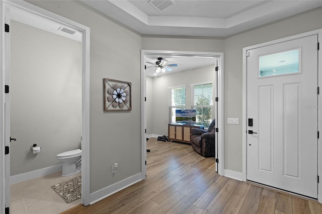 foyer entrance with light hardwood / wood-style flooring