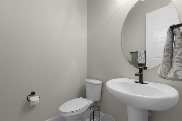 bathroom with toilet and sink