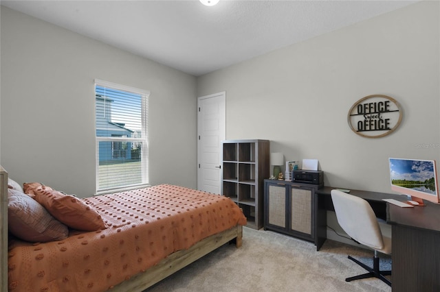 bedroom featuring light carpet