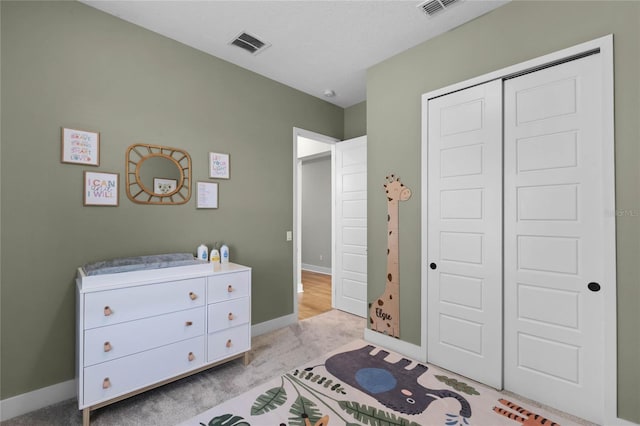 carpeted bedroom with a closet