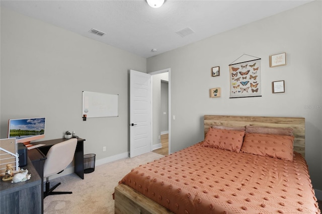 bedroom featuring light colored carpet