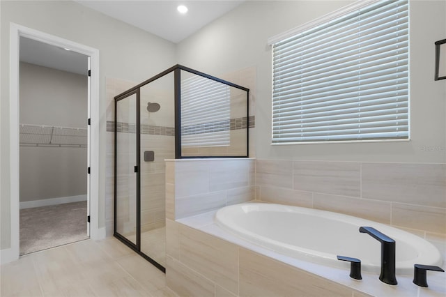 bathroom with separate shower and tub