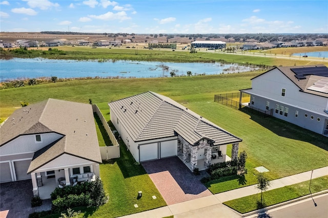 birds eye view of property featuring a water view