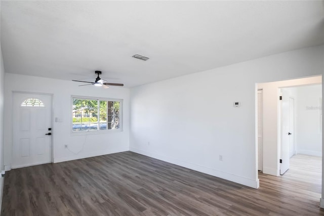 interior space with ceiling fan and dark hardwood / wood-style floors