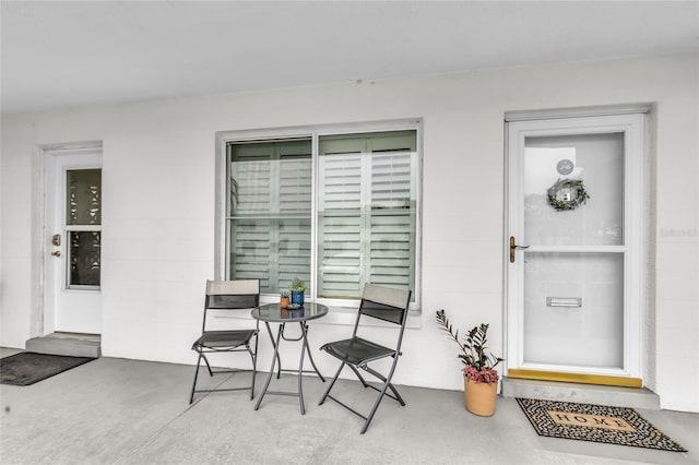 doorway to property with a patio area