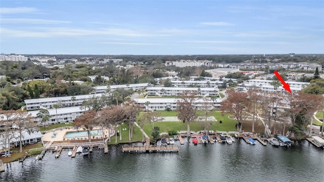 birds eye view of property with a water view
