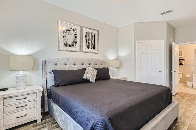 bedroom featuring connected bathroom