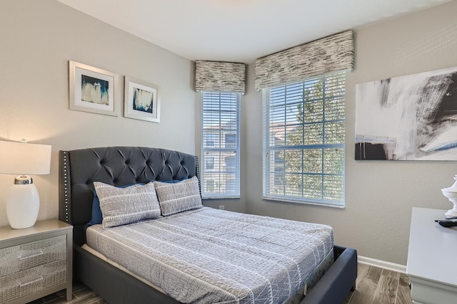 bedroom with hardwood / wood-style floors