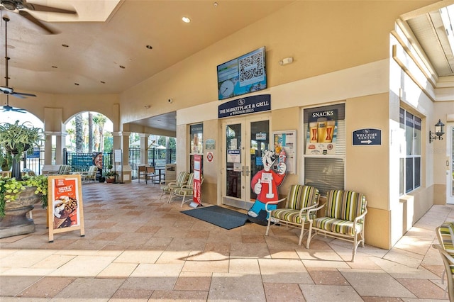 exterior space with ceiling fan