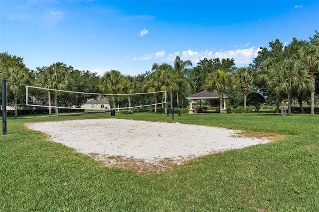 surrounding community featuring a gazebo, volleyball court, and a lawn