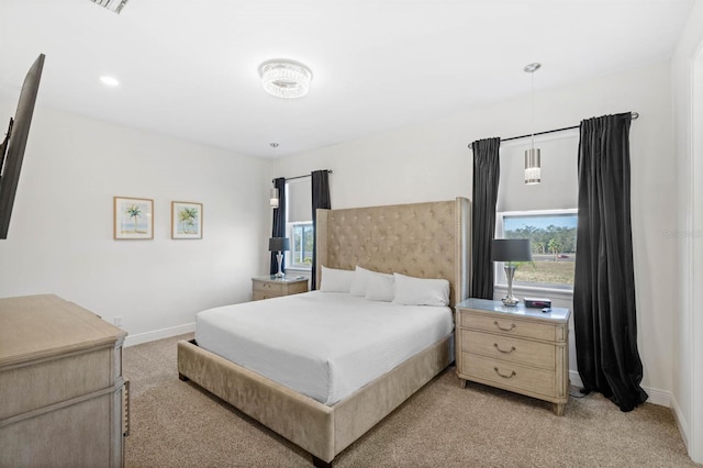 bedroom with light colored carpet