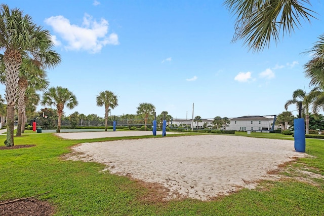 view of home's community featuring a lawn and volleyball court