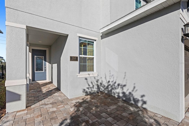 doorway to property featuring a patio