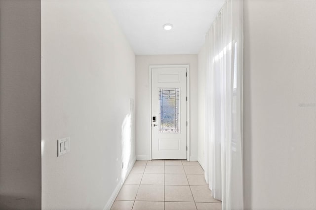 hallway with light tile patterned floors