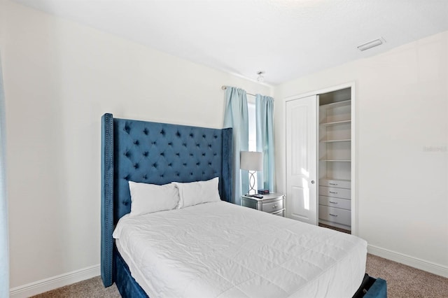 bedroom with carpet floors and a closet