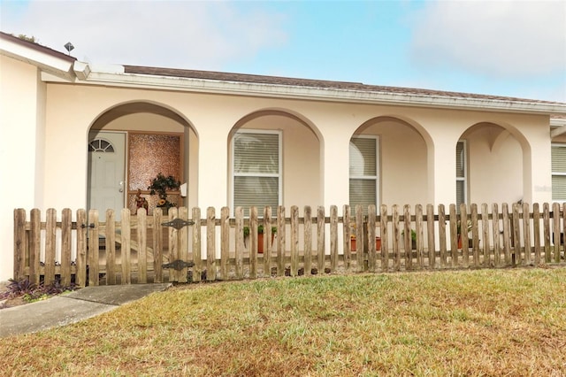 view of property exterior featuring a lawn