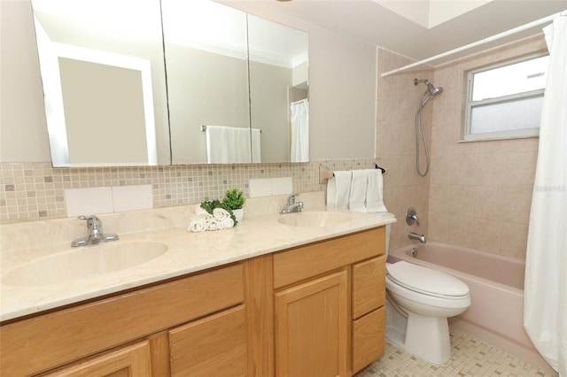 full bathroom with shower / tub combo with curtain, vanity, toilet, and backsplash