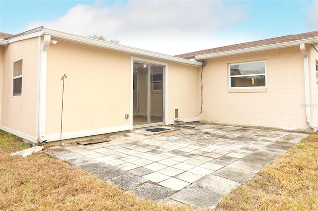 rear view of house with a patio