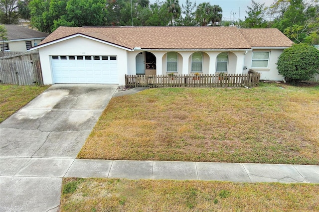 ranch-style house with a front lawn and a garage