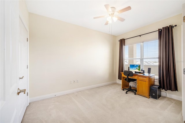 carpeted home office with ceiling fan