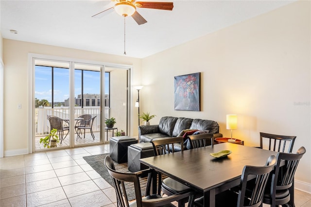 dining space featuring light tile patterned floors and ceiling fan