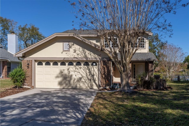 view of front of house featuring a front lawn and a garage