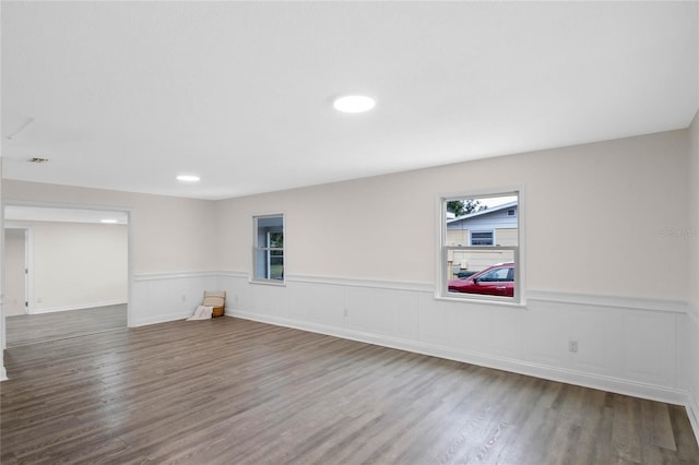 spare room featuring wood-type flooring