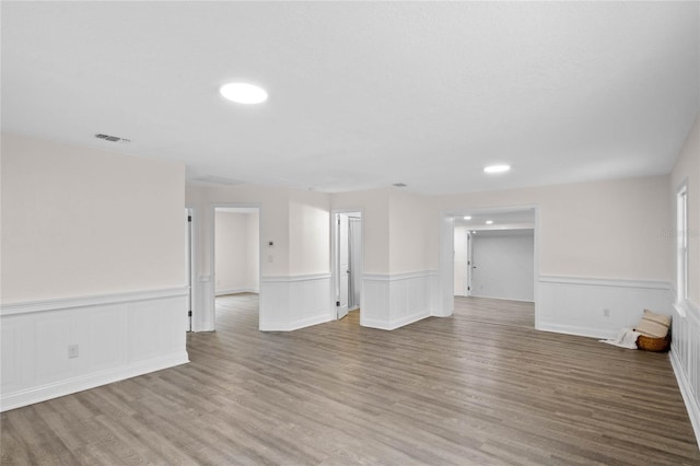 unfurnished living room featuring wood-type flooring