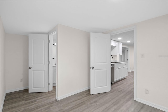 spare room featuring light wood-type flooring