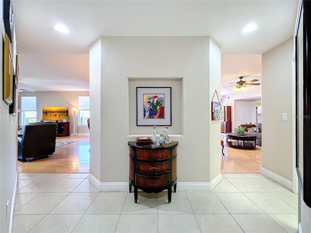 hallway with light tile patterned floors