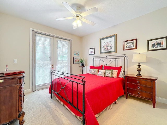 carpeted bedroom featuring access to outside and ceiling fan