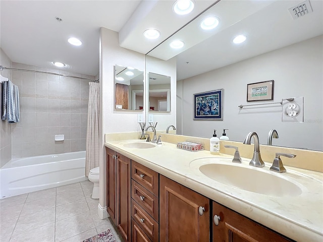 full bathroom featuring shower / tub combo with curtain, tile patterned floors, toilet, and vanity