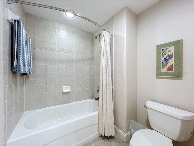 bathroom with shower / bath combination with curtain, tile patterned floors, and toilet