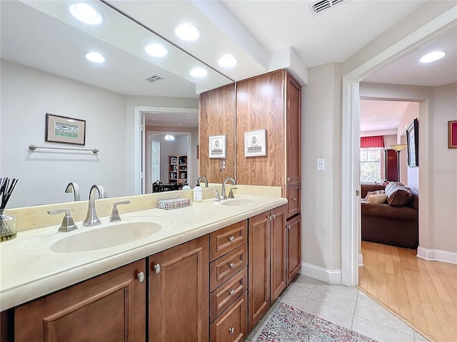 bathroom with vanity and tile patterned floors