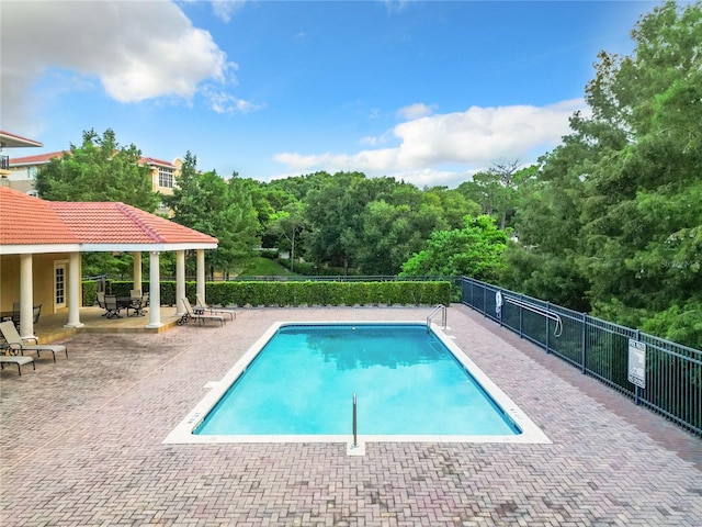 view of swimming pool featuring a patio