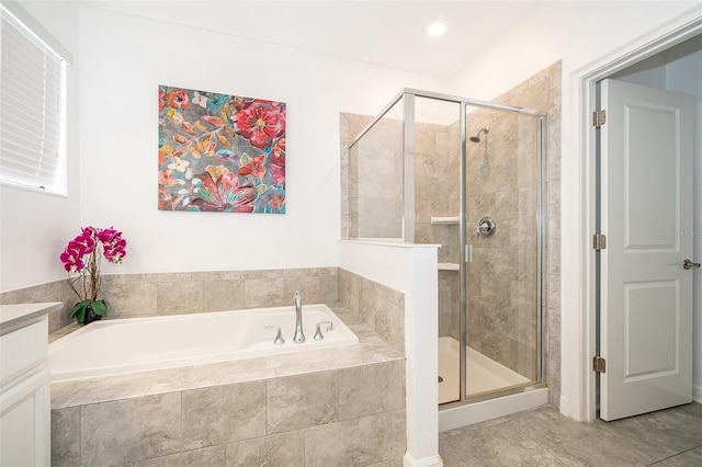 bathroom featuring tile patterned floors, vanity, and plus walk in shower