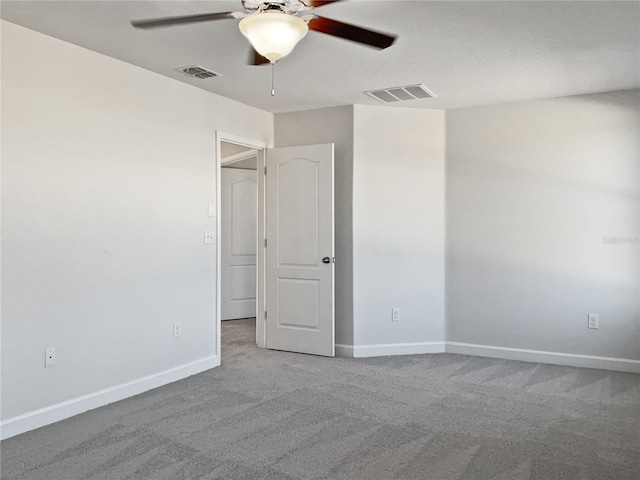 empty room with carpet floors and ceiling fan