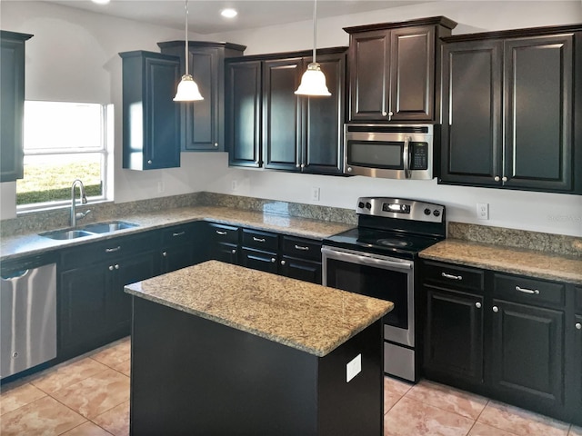 kitchen featuring pendant lighting, a center island, stainless steel appliances, light tile patterned flooring, and sink