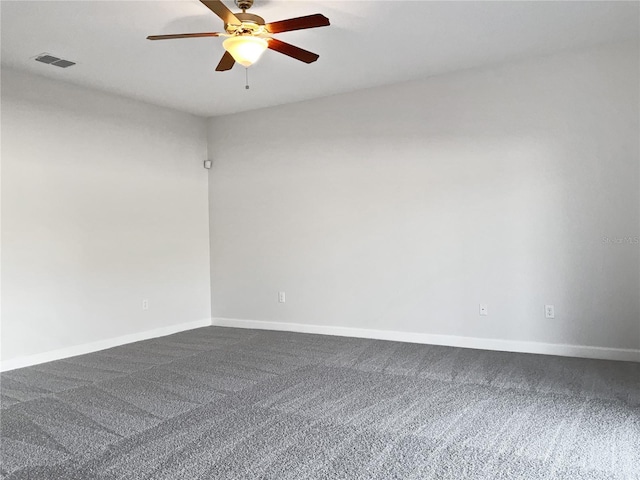 spare room with ceiling fan and carpet flooring