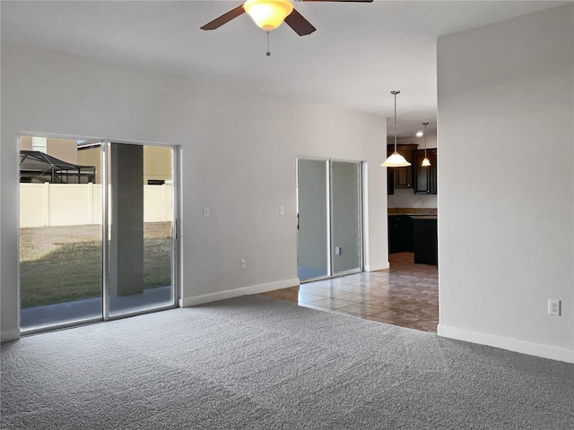 carpeted empty room with ceiling fan