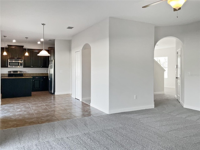 interior space featuring ceiling fan